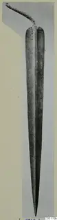 Corroded metal sword with a long tapering blade and a narrow tang, from the Lapithos tombs