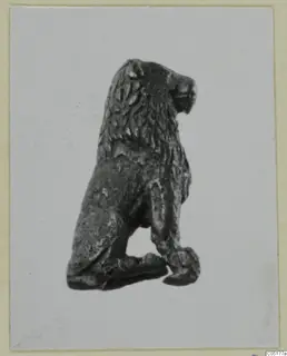 Bronze figurine of a seated lion with a carved mane, from Ayios Iakovos