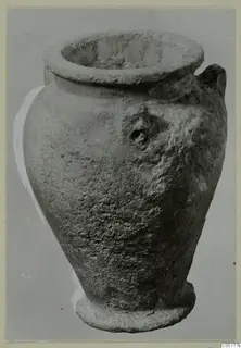 Single-handled vessel with a wide flaring rim and ring base, shown alone against a grey background
