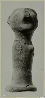 Terracotta figurine with a large head and cylindrical body, from the Ayios Iakovos series
