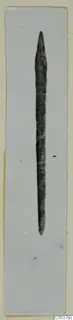Long slender metal object tapering to a point at both ends, from Ayios Iakovos Tomb 8