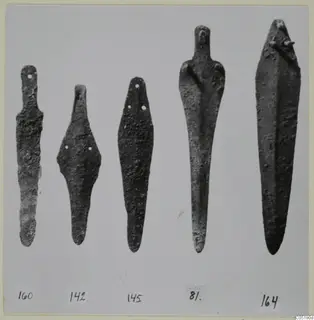 Five flat bronze implements from Ayios Iakovos, pointed at the lower end, lined up with number labels below