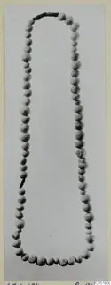 Necklace of pale, rounded beads strung on a dark cord, Ayios Iakovos