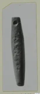 Long tapering object with a hole near its narrow upper end, shown upright against a pale background