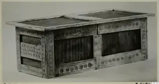 Chest of pale material with a flat lid and panels decorated with rows of concentric rings, from Enkomi