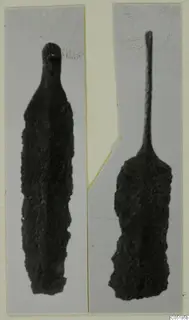 Two corroded bronze tools from Lapithos Tomb 320, photographed side by side on a card mount.