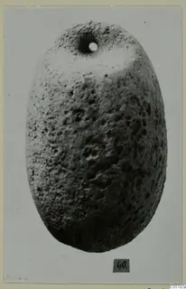 Oval pitted object with a round hole near its narrow end, a small find from Lapithos Tomb 315 A