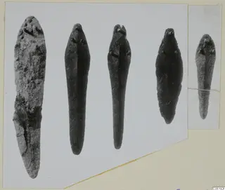 Mounted photographs of elongated bronze tools and small finds from Lapithos Tomb 315 A