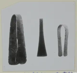 Three bronze objects from Lapithos Tomb 315 A laid side by side on a pale card mount