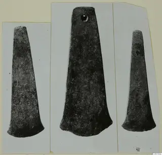 Three photographs of tapering bronze tools mounted on a card, from a tomb group at Lapithos