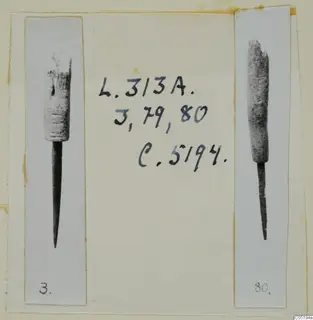 Two bronze tools from Lapithos Tomb 313 A, each photographed upright on a mounted card with number labels