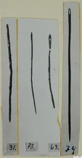 Long thin metal pins and a needle from Lapithos Tomb 313 B, each shown in its own cut-out strip with a number label.