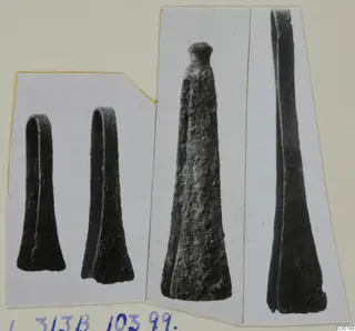 Four metal objects from Lapithos Tomb 313 B, shown in separate views on a mounted card