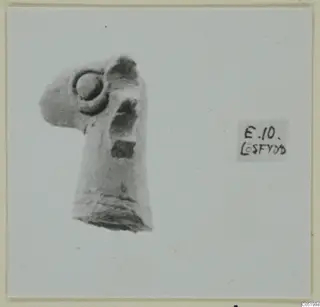 Fragment of a small figurine with a round boss on its upper part, a stray find from Enkomi
