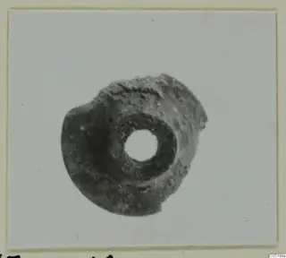 Disc-shaped object with a central hole, from Enkomi Tomb 16