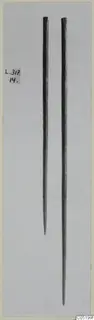 Two pointed bronze tools from Lapithos, shown upright side by side