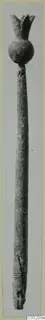 Long slender object with a knobbed top, photographed upright, from Enkomi Tomb 3