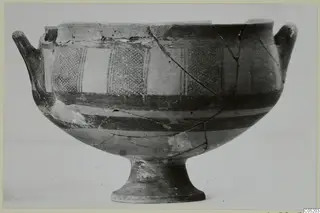 White Painted I bowl from Lapithos, with two handles, a footed base and painted bands and panels