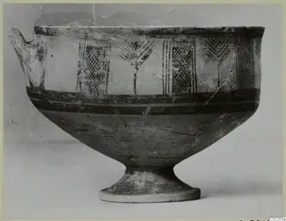 White Painted I bowl with a side handle and vertical panels of painted motifs, photographed against a plain background