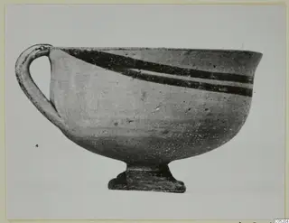 White Painted I bowl with a loop handle and two dark painted bands near the rim