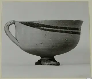 Pottery White Painted I bowl with one loop handle and two dark painted bands near the rim