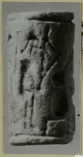 Cylinder seal from Enkomi, side view with carved motifs, photographed out of focus