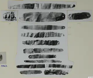 Photo mount of thin metal strips with small holes, and two small photos of embossed gold ornament, from Enkomi Tomb 3 finds.