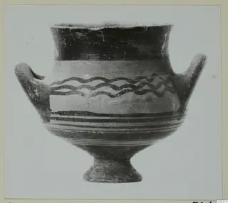 Pottery Bichrome I amphoriskos from the Lapithos Kastros tombs, a two-handled vessel with wavy painted bands