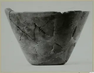 Stone Age pottery bowl from Kythrea, seen from the side against a pale background