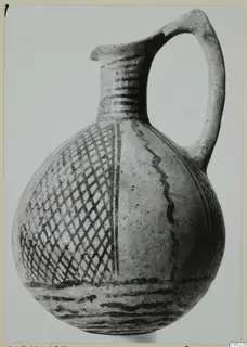 White Painted III-2 jug with a strap handle and dark painted lattice and band decoration, from Lapithos