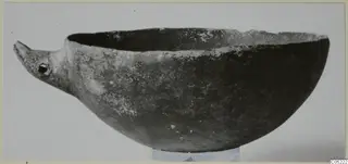 Black slip ware bowl with a beak-like projection at one side, from Ayios Iakovos