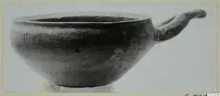 Bowl with a single loop handle, from Enkomi, shown in a side view against a plain light background