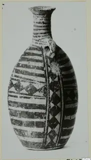 White Painted III-2 pottery bottle with horizontal bands and triangle patterns, photographed on a plain background