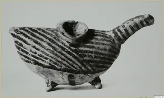 Painted pottery vessel with a long spout, a collar-shaped opening and three legs, decorated with dark diagonal bands