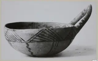 Pottery White Painted III-2 bowl with a long handle and dark painted hatched and zigzag bands