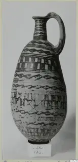 White Painted III-2 jug from Lapithos, with dark painted bands, wavy lines and checkered panels