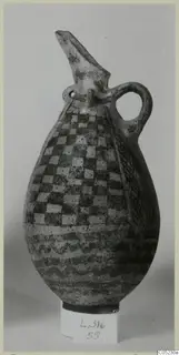 Pottery White Painted III-2 vessel: a pear-shaped jug with a beaked spout, loop handle and checkerboard and wavy painted bands.