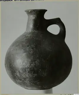Pottery jug, Red Polished III, with a single loop handle, from the Vrysi tou Barba tombs at Lapithos.
