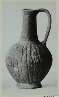 Jug with a tall neck, single loop handle and vertical grooves on the body, from Lapithos