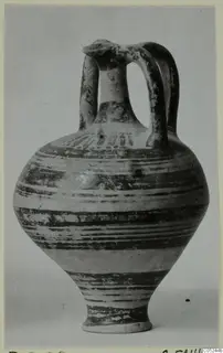 Pottery jug in Levanto-Helladic Ware with two loop handles and horizontal bands of dark paint on a pale body.