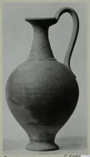 Plain White Wheel-made jug from Enkomi with a single loop handle, shown against a plain grey background