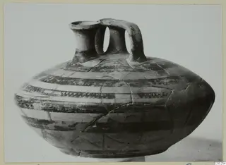 Pottery bowl-jar from Enkomi with two tubular necks, a strap handle and horizontal painted bands
