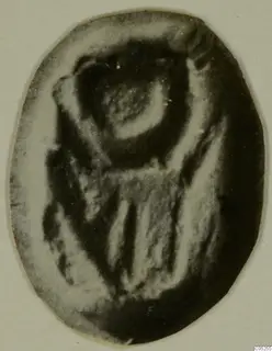 Oval glyptic object, a seal or gem with an engraved design, shown against a pale background