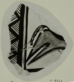 Pottery Bichrome Wheel-made sherd with black painted bands and hatched patterns, on a pale card