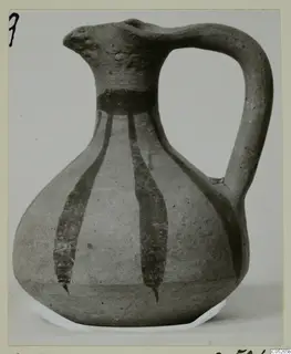 Pottery jug with a single loop handle and dark painted vertical stripes running down a pale body