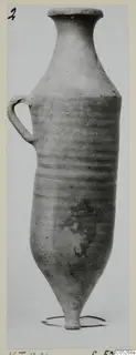 Cypro-Hell. I jug with a long neck, single loop handle and pointed base, standing on a wire ring