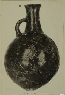 Red Polished III pottery jug with a single loop handle and flared neck
