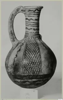 White Painted III-2 jug from Lapithos, with a loop handle, banded neck and lattice-patterned body
