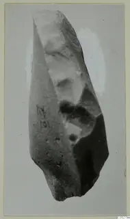 Worked stone object from Kythrea with flaked faces and a handwritten number on its side