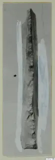 Long narrow stone find from Kythrea, tapering at the top, with a rough dark edge, photographed on a grey background.